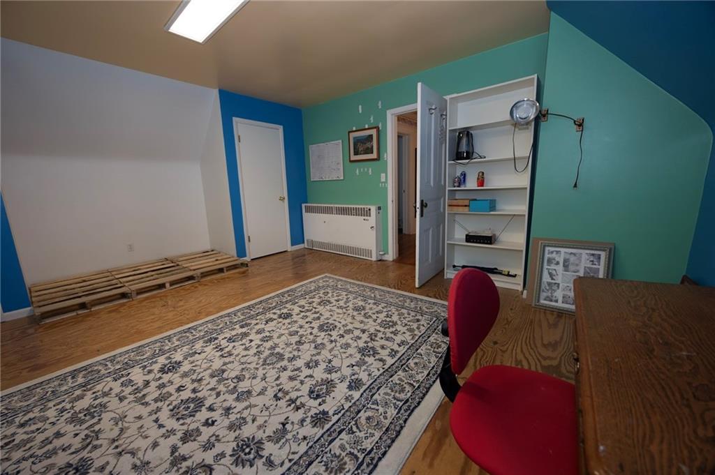 200 School Street Pittsburgh, PA 15205 - Photo 30 of 46 a bedroom with a bed and a book shelf