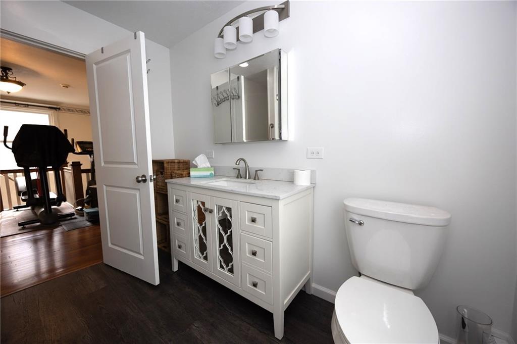 200 School Street Pittsburgh, PA 15205 - Photo 31 of 46 a bathroom with a toilet sink and mirror
