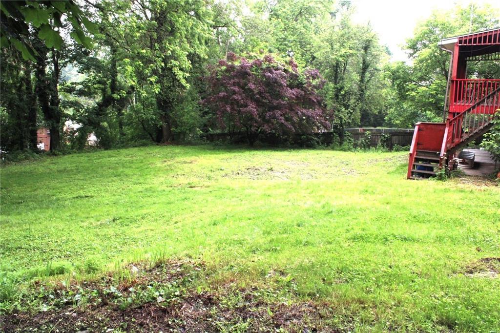 200 School Street Pittsburgh, PA 15205 - Photo 45 of 46 a backyard of a house with lots of green space and fountain