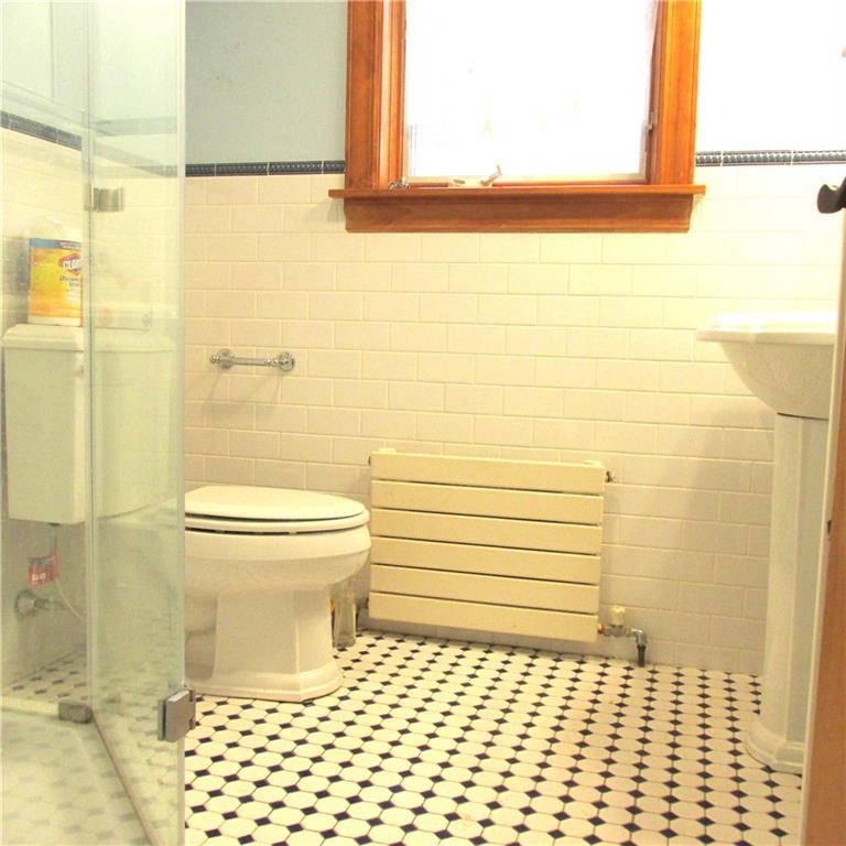 200 School Street Pittsburgh, PA 15205 - Photo 6 of 46 a bathroom with a toilet and a shower