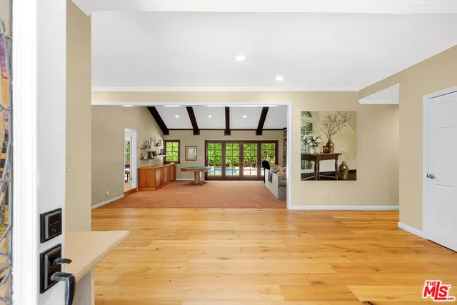 a view of a room with furniture and window