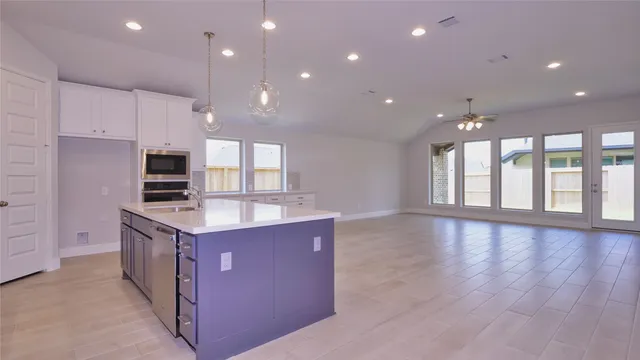 a large kitchen with cabinets