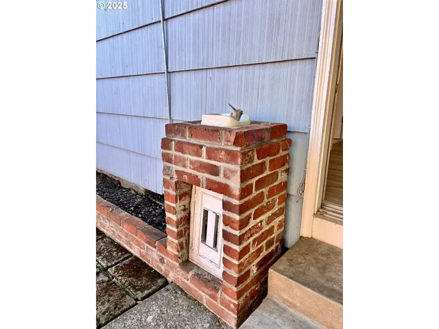 a view of staircase with white walls