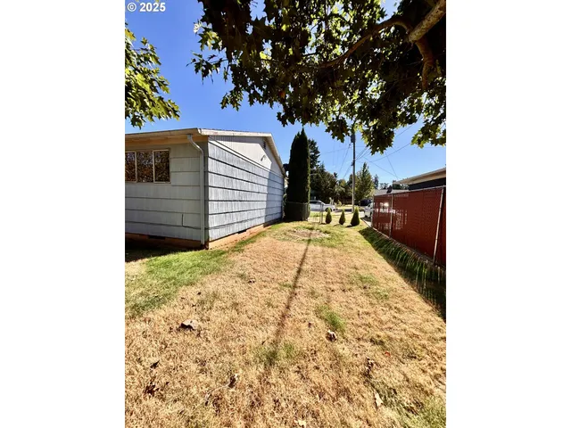 a view of a backyard of the house