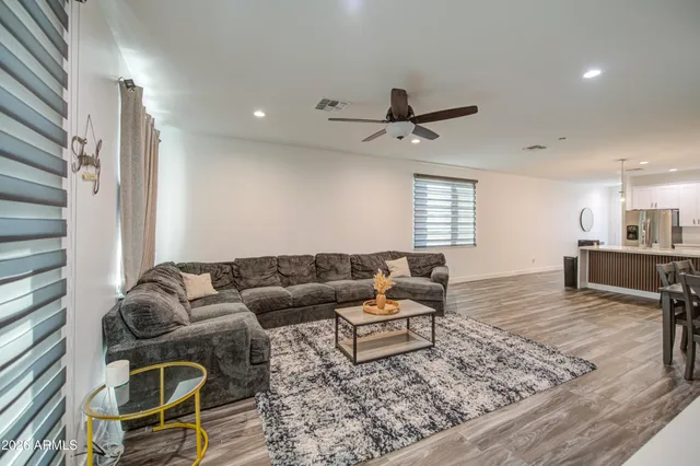 a bedroom with furniture and a flat screen tv