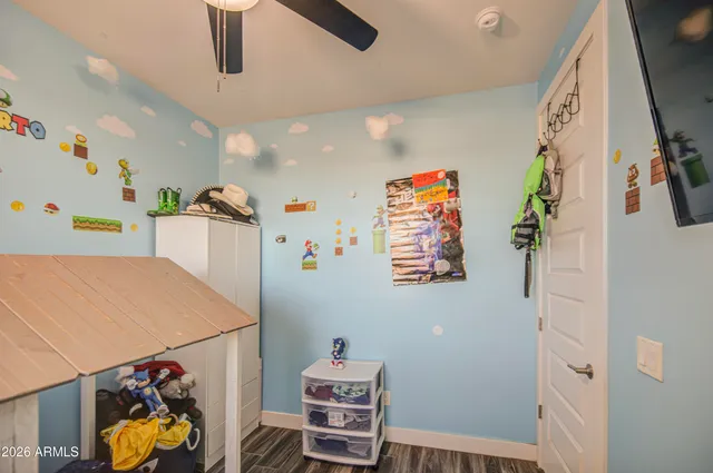 a view of a terrace with lawn chairs