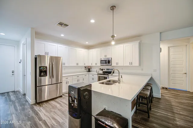 a view of living room with granite countertop furniture and a large window