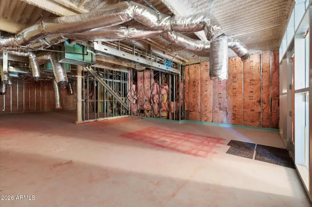 a view of empty room with wooden walls