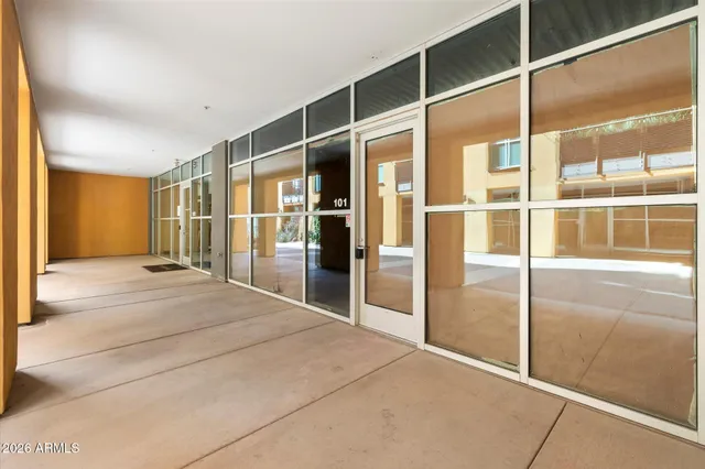 a spacious bedroom with a large window