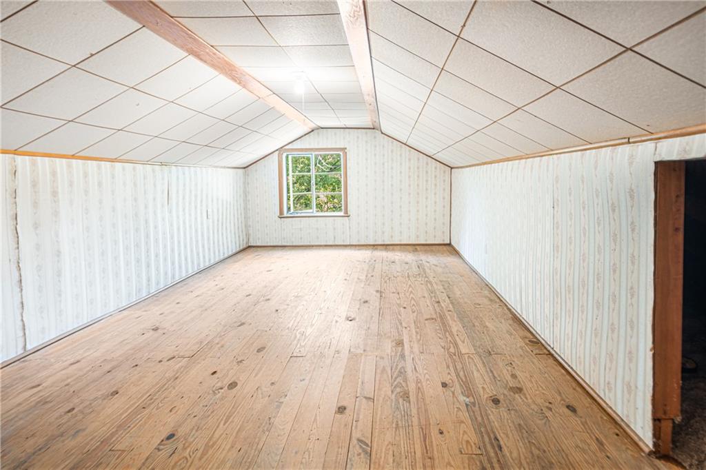 845 Pittsburgh Road Butler, PA 16002 - Photo 18 of 24 an empty room with wooden floor and windows