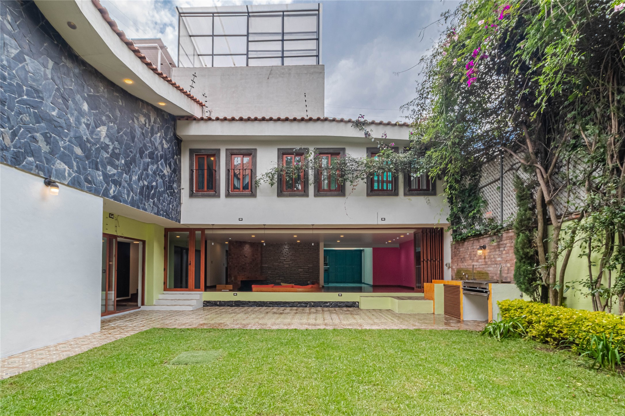 10 Cerrada Loma Nevada Remsenburg, NV 11960 - Photo 24 of 50 a front view of a house with a yard garage and outdoor seating