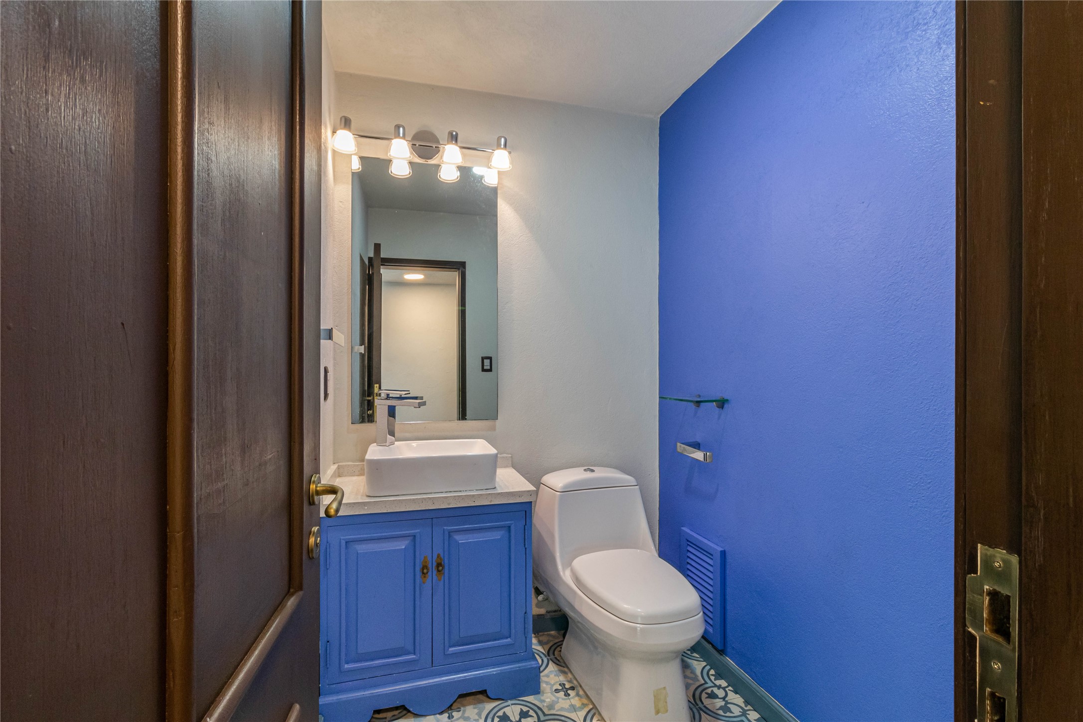 10 Cerrada Loma Nevada Remsenburg, NV 11960 - Photo 25 of 50 a bathroom with a toilet a sink and mirror