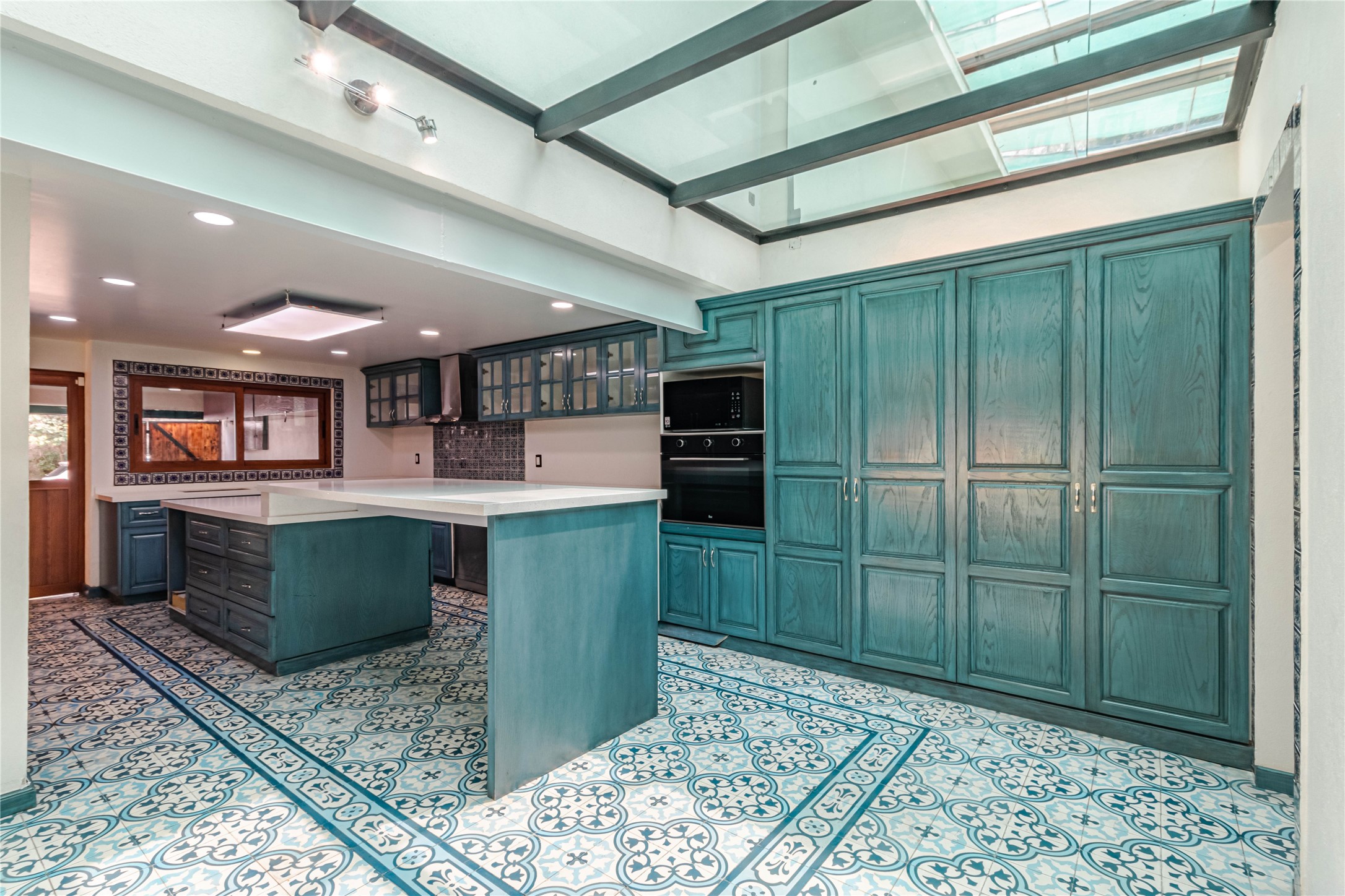 10 Cerrada Loma Nevada Remsenburg, NV 11960 - Photo 8 of 50 a kitchen with stainless steel appliances kitchen island granite countertop a refrigerator and a sink