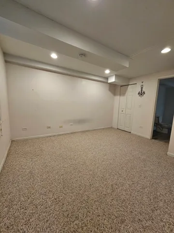 an empty room with a empty space and windows