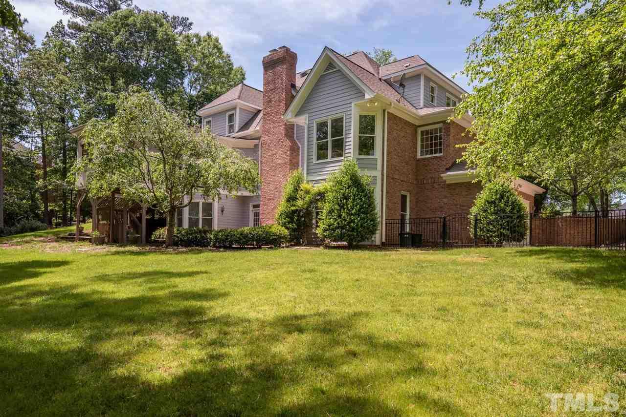 4407 White Chapel Way Raleigh, NC 27615 - Photo 23 of 25 Beautiful, well maintained yard with plenty of space for entertaining.