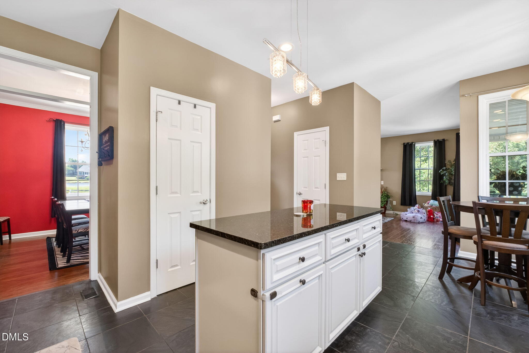 923 White Memorial Church Road Willow Spring, NC 27592 - Photo 21 of 46 a room with kitchen island granite countertop a sink and cabinets
