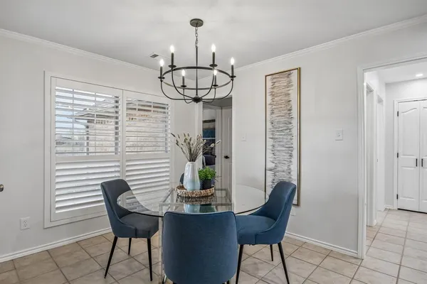 a dining room with furniture and window