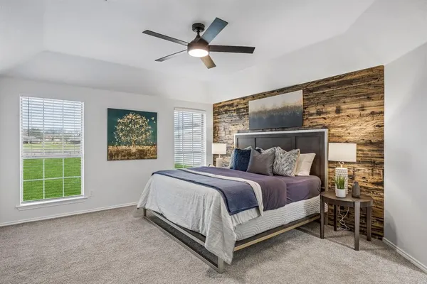 a bed room with a bed and a window