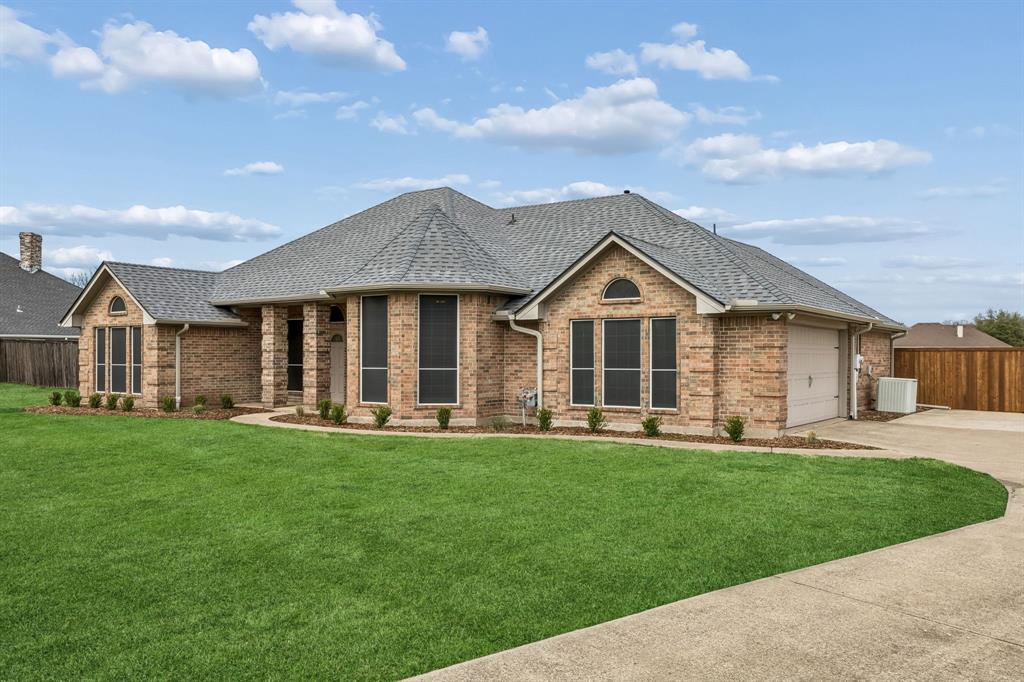 11090 Prairie Lakes Lane Forney, TX 75126 - Photo 2 of 40 a front view of a house with a yard and porch