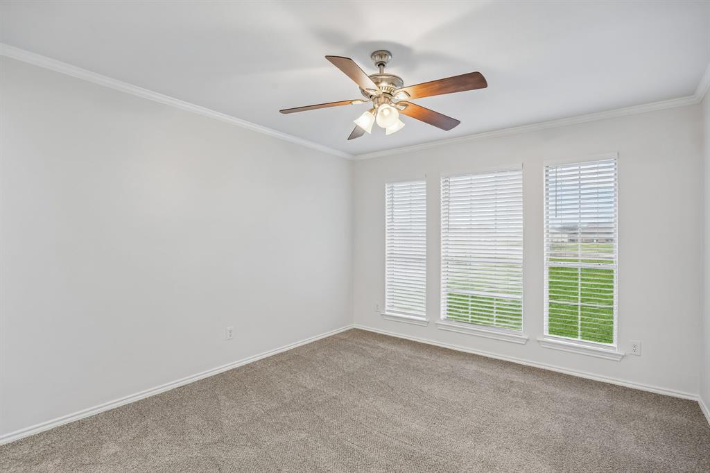 11090 Prairie Lakes Lane Forney, TX 75126 - Photo 25 of 40 an empty room with windows and fan