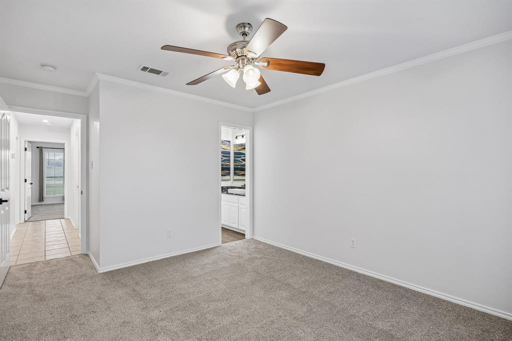 11090 Prairie Lakes Lane Forney, TX 75126 - Photo 26 of 40 an empty room with closet and a chandelier fan