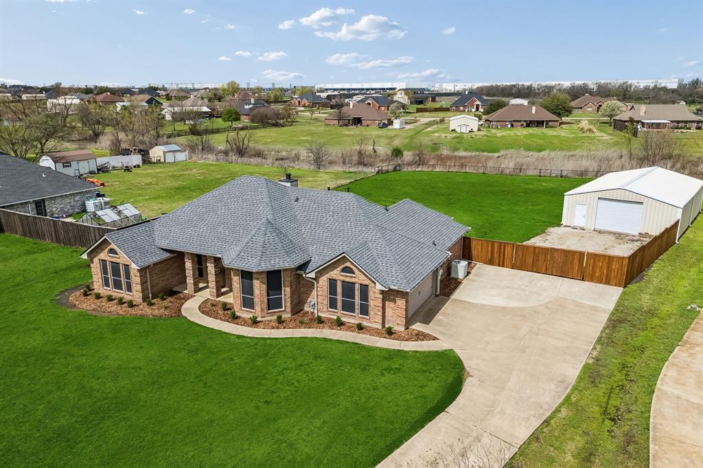 11090 Prairie Lakes Lane Forney, TX 75126 - Photo 34 of 40 an aerial view of a house with garden space and street view