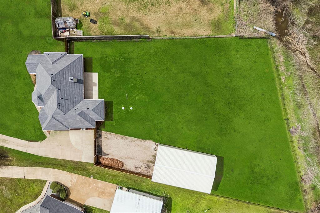 11090 Prairie Lakes Lane Forney, TX 75126 - Photo 35 of 40 an aerial view of a house with a yard