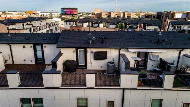 an aerial view of residential houses with street