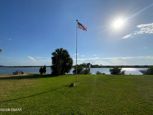 a view of a golf course with a lake