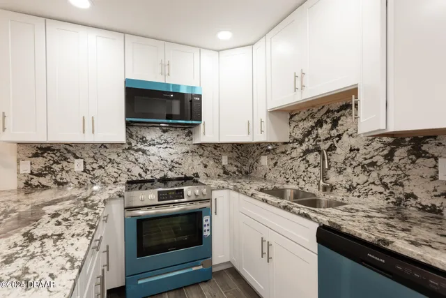 a kitchen with a stove and a sink