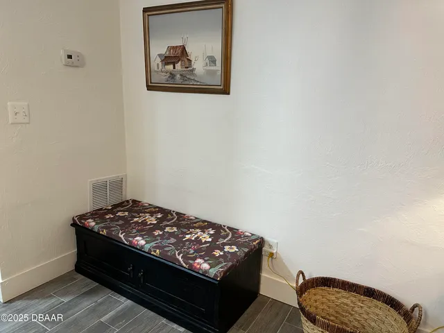 a white toilet sitting next to a shower curtain