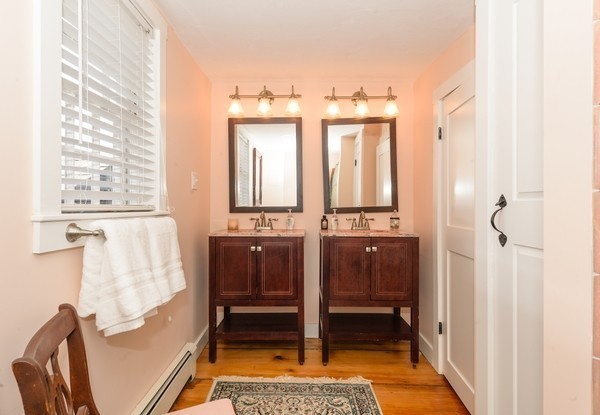 58 Summer Street Marshfield, MA 02050 - Photo 18 of 30 a bathroom with a tub sink and mirror