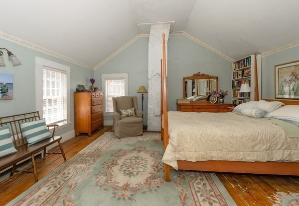 58 Summer Street Marshfield, MA 02050 - Photo 22 of 30 a bedroom with a bed and wooden floor