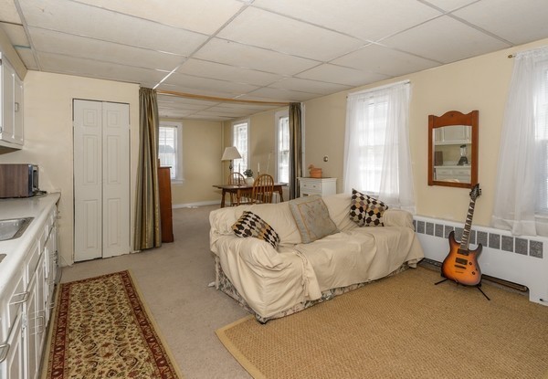 58 Summer Street Marshfield, MA 02050 - Photo 26 of 30 a living room with furniture and a rug