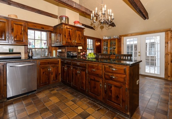 58 Summer Street Marshfield, MA 02050 - Photo 7 of 30 a kitchen with stainless steel appliances granite countertop a sink and wooden cabinets