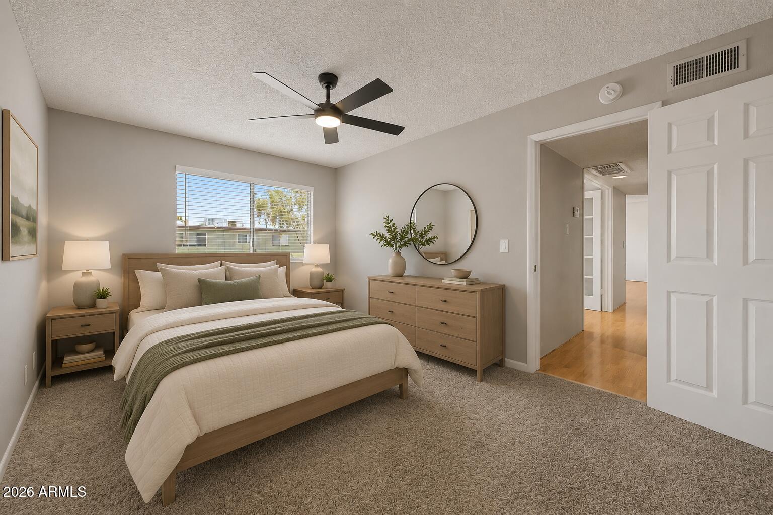 424 West Brown Road, Unit 248 Mesa, AZ 85201 - Photo 9 of 19 a bed room with a bed and a ceiling fan
