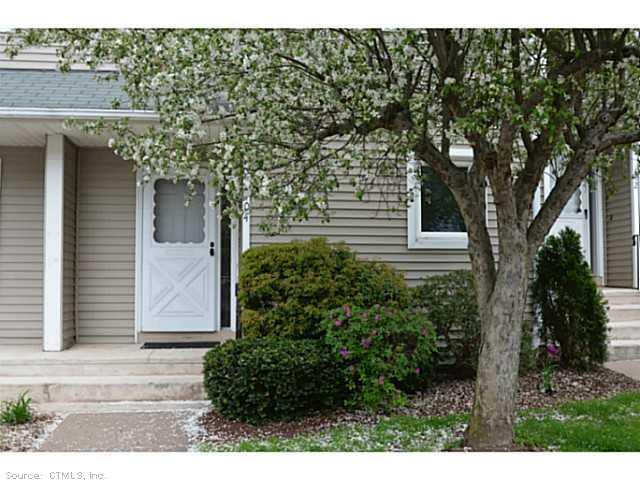 104 Oak Ridge Drive, Unit 104 Windsor Locks, CT 06096 - Photo 1 of 1 a view of a house with a tree
