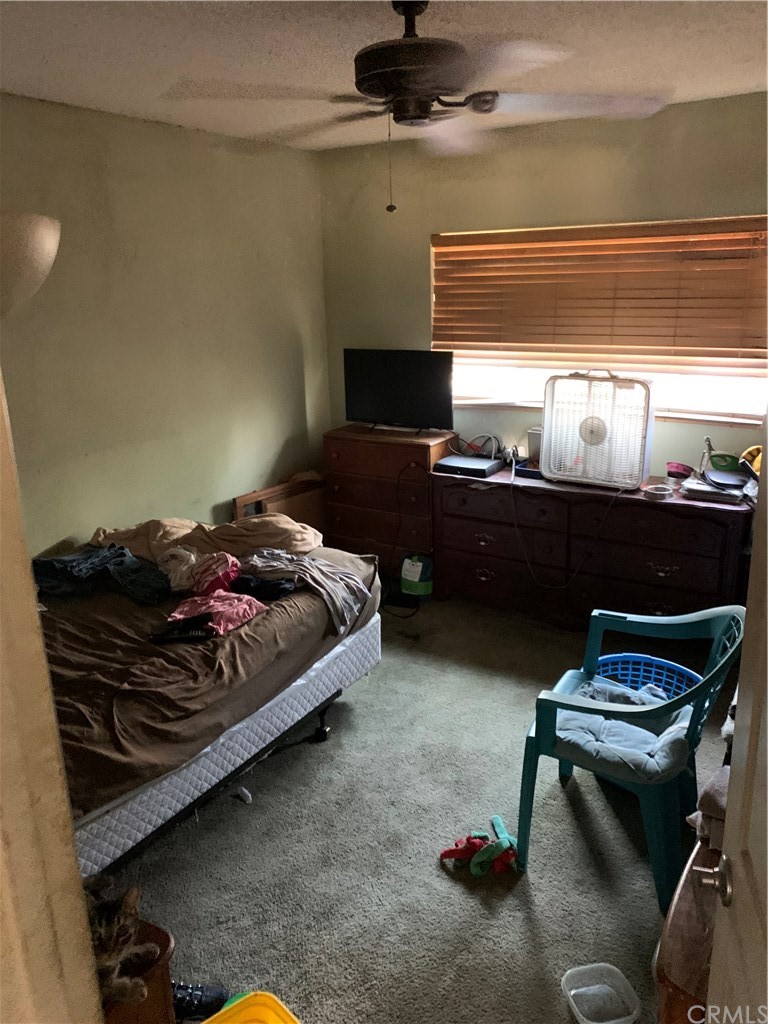 7771 Philbin Avenue Riverside, CA 92503 - Photo 18 of 30 a living room with furniture and a flat screen tv