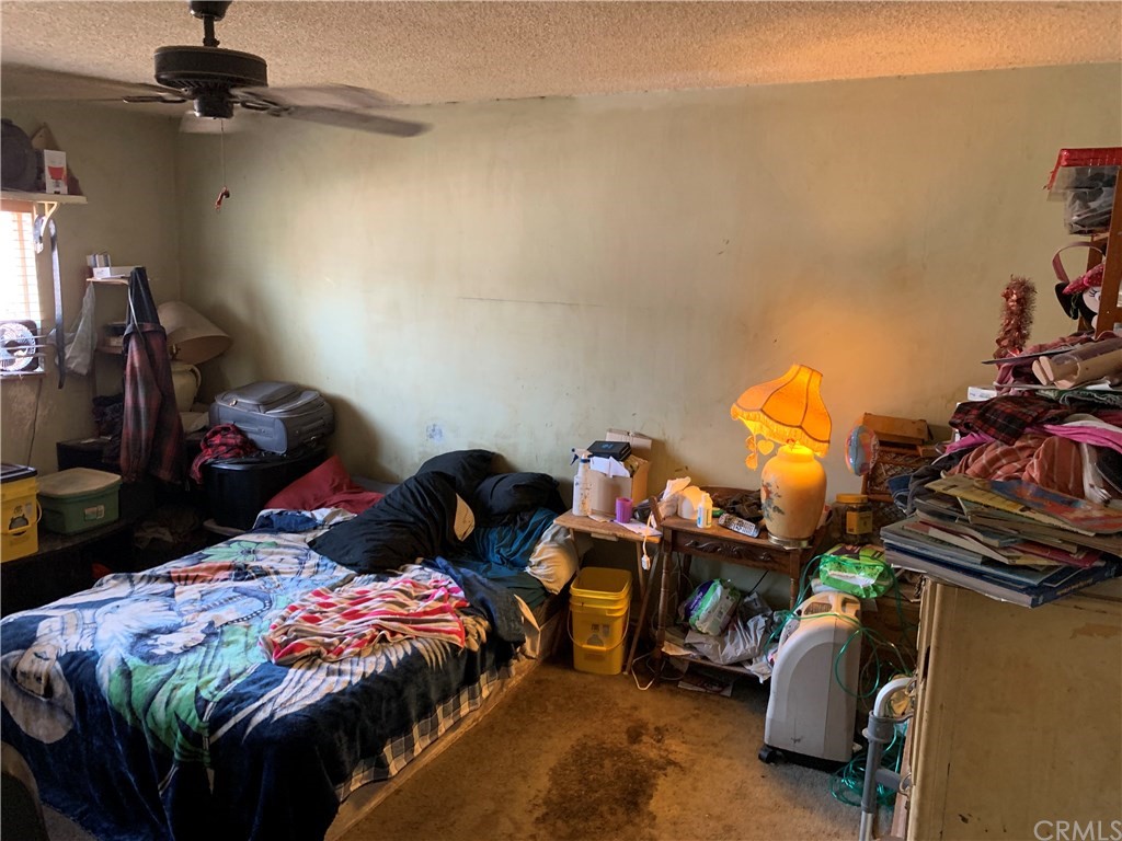 7771 Philbin Avenue Riverside, CA 92503 - Photo 19 of 30 a bed room with a bed and a closet