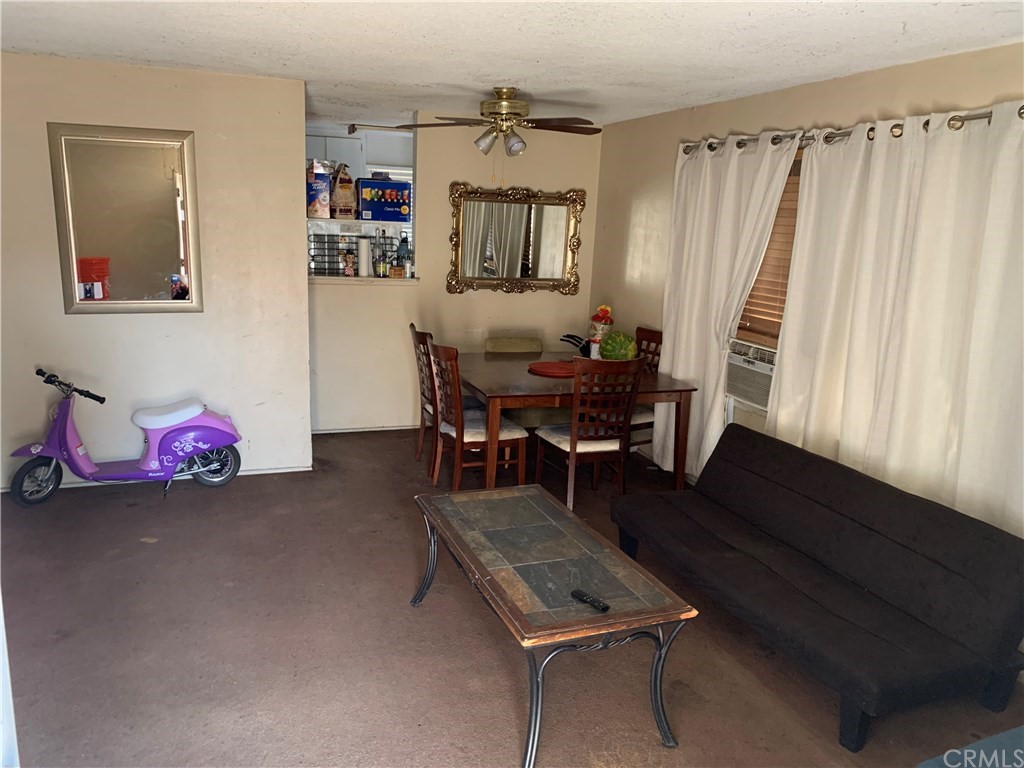 7771 Philbin Avenue Riverside, CA 92503 - Photo 21 of 30 a living room with furniture and a wooden floor