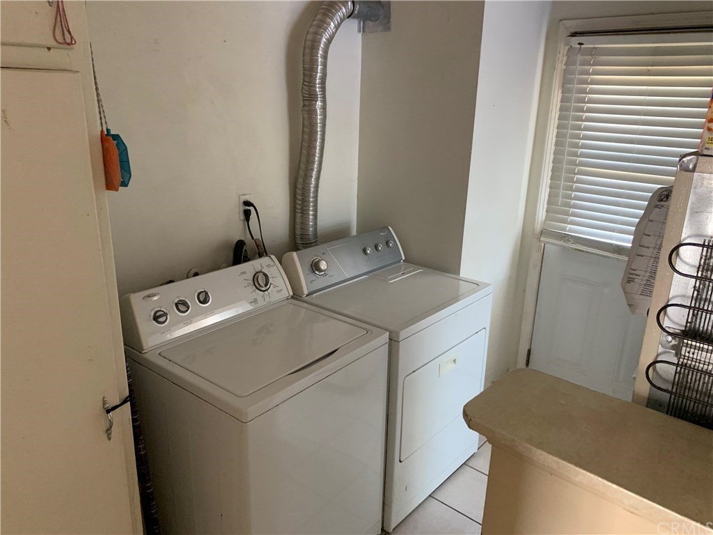7771 Philbin Avenue Riverside, CA 92503 - Photo 24 of 30 a utility room with dryer and washer