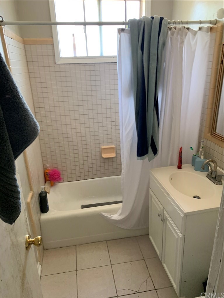 7771 Philbin Avenue Riverside, CA 92503 - Photo 26 of 30 a bathroom with a sink toilet and shower