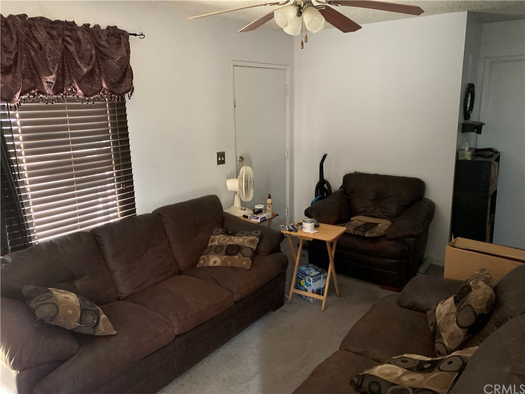7771 Philbin Avenue Riverside, CA 92503 - Photo 3 of 30 a living room with furniture and a window