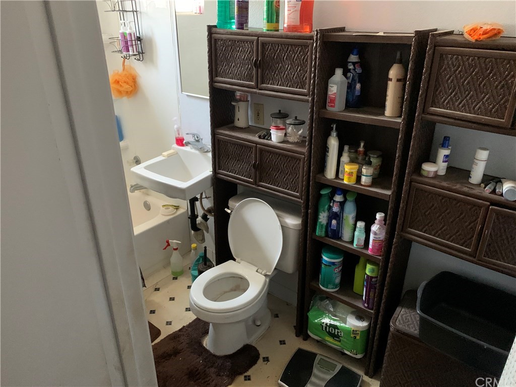 7771 Philbin Avenue Riverside, CA 92503 - Photo 5 of 30 a bathroom with a toilet and a sink