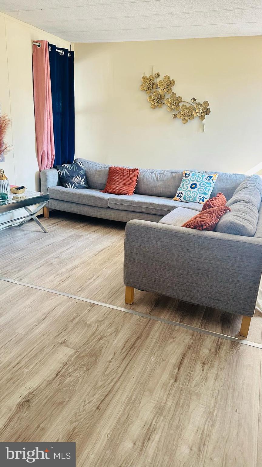 4851 Perkiomen Avenue Reading, PA 19606 - Photo 9 of 12 a living room with furniture and wall painting