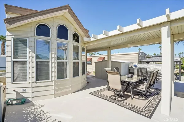 a view of a chairs and table in a patio