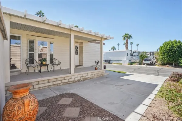 a view of a house with outdoor space and sitting area