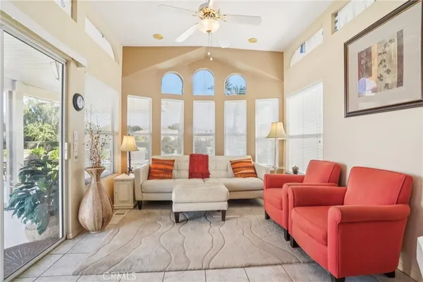 a living room with furniture and a large window