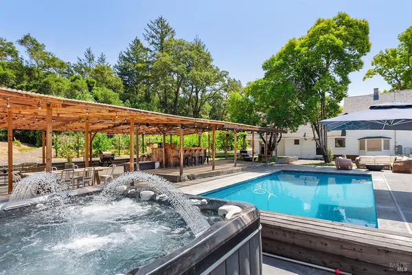 an outdoor view of the patio and swimming pool