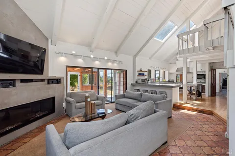 a view of a livingroom with furniture and a window